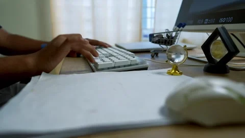 Close-Up of Hands Typing on Computer Keyboard on Office Desk Table Stock Footage 315981643
