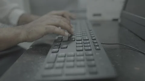 Close-up of hands typing on a computer keyboard in an office Stock-Footage 327353281