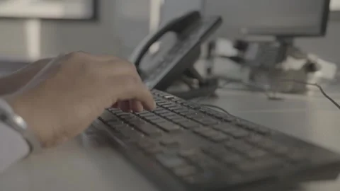 Close-up of hands typing on a computer keyboard in an office Stock-Footage 327451883