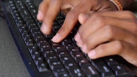 Close-up of hands typing on a computer keyboard with motion blur 스톡 동영상 329369631