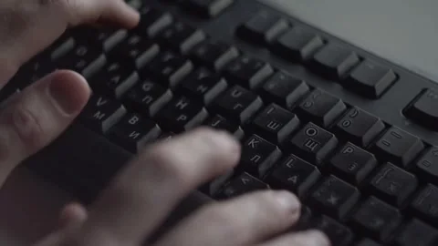 Close Up of Hands Typing on Computer Keyboard in Office Stockbeeldmateriaal 334563039