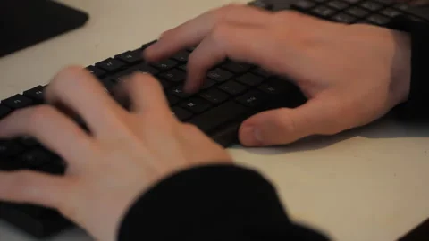 Close Up Of Hands Typing On Computer Keyboard Video stock 336559898