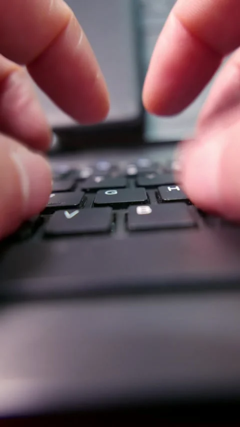 Close-up: hands typing on a computer keyboard on a table. A dusty keyboard Stock Footage 340298239