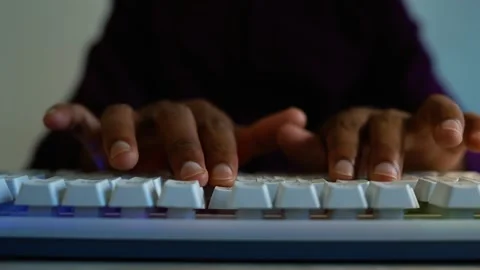 Close-up hands typing on computer keyboard, Close-up of dark-skinned hands .. Stock Footage 346462940