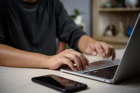 Close-up of hands typing on computer keyboard, casual attire, data entry, v.. Stock Photos