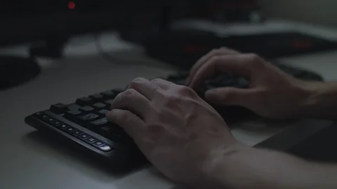 Close up of hands typing on a generic black keyboard from an angle. 4k UHD. Stock Footage 90214102