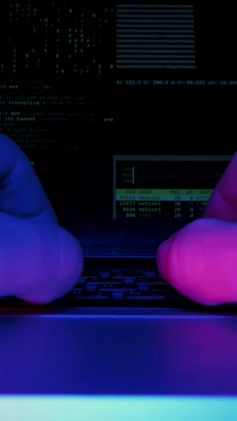 Close up of hands typing on keyboard, code is shown on screen. Vertical video Stock Footage 317305157