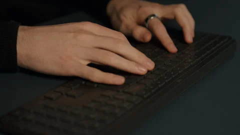 Close-Up of Hands Typing on Keyboard, Fast and Focused Stock Footage 322785171