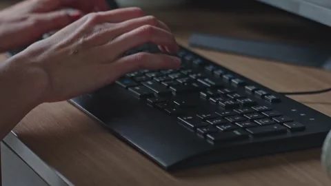 Close up of hands typing on keyboard in home office. Concept of remote work Stock Footage 332375499