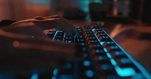 Close up hands typing on keyboard programmer coding software gamer using Stock Footage 138395002