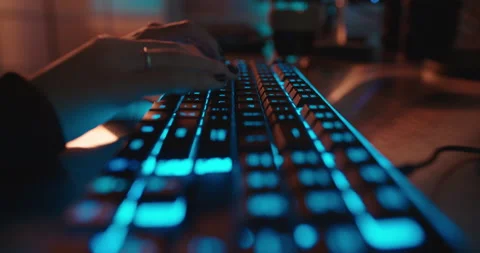 Close up hands typing on keyboard programmer coding software gamer using Stock Footage 138395037