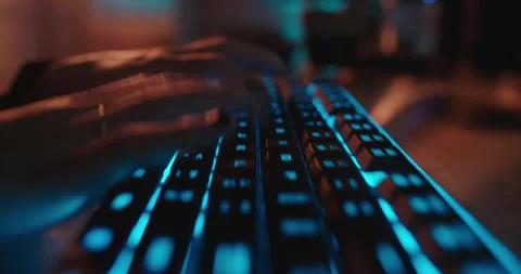 Close up hands typing on keyboard programmer coding software gamer using Stock Footage 138395053