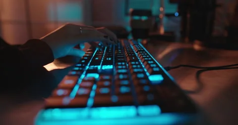 Close up hands typing on keyboard programmer coding software gamer using Stock Footage 138395068