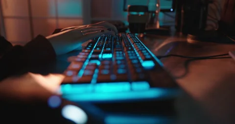 Close up hands typing on keyboard programmer coding software gamer using Stock Footage 138395081