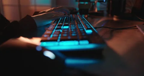 Close up hands typing on keyboard programmer coding software gamer using Stock Footage 138395102