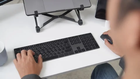 Close Up of Hands Typing on Keyboard for Remote Working Environment Using T.. Stock Footage 336680678