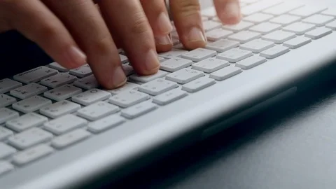Close up hands Of Typing On Keyboard Of A White Computer Laptop., indoors 動画素材 114229853