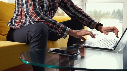 Close-up of hands typing on keyboard. Young man freelancer student sitting on Stock Footage 124307454
