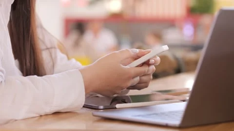 Close-up of hands typing on laptop in casual setting Stock Footage 314410847