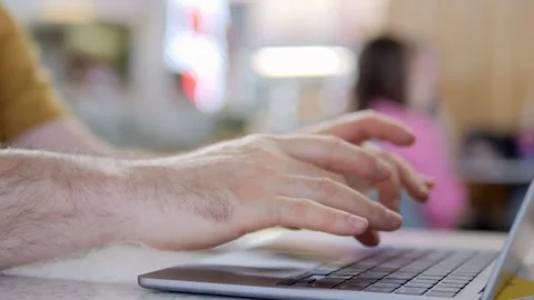 Close-up of hands typing on laptop in casual setting Stock Footage 341490338