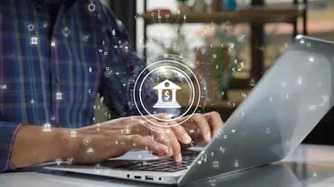 Close-up of hands typing on laptop with digital banking icons and currency .. Stock-Fotos