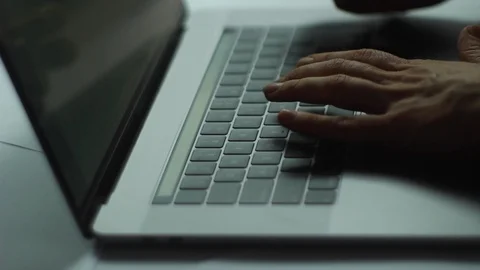 Close up of hands typing on laptop, doing online banking or shopping with a Stock Footage 121585238