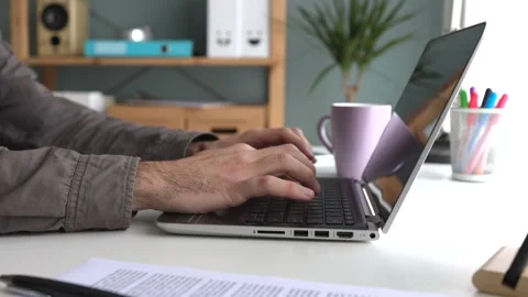 Close-up of hands typing on a laptop Stock-Footage 238447124
