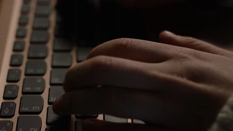 Close up of hands typing on laptop keyboard in slow motion Video stock 128583976