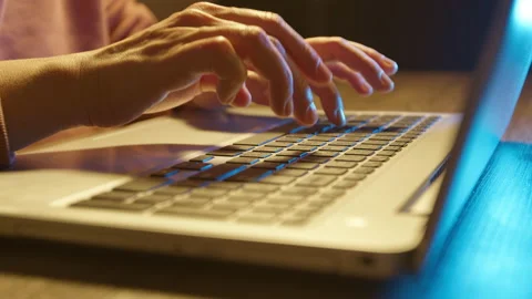 Close-up of hands typing on a laptop keyboard. Stock Footage 223900992