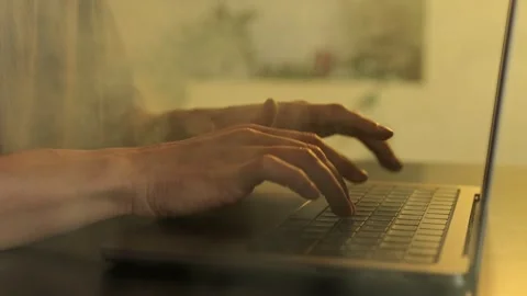Close-up of Hands Typing on Laptop Keyboard Through Smoke, Symbolizing Work Stock Footage 295930755