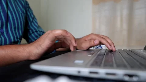 Close-up of hands typing on a laptop keyboard Stock Footage 317737431