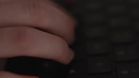 Close-up of hands typing on laptop keyboard, symbolizing digital work, office Stock Footage 317951887