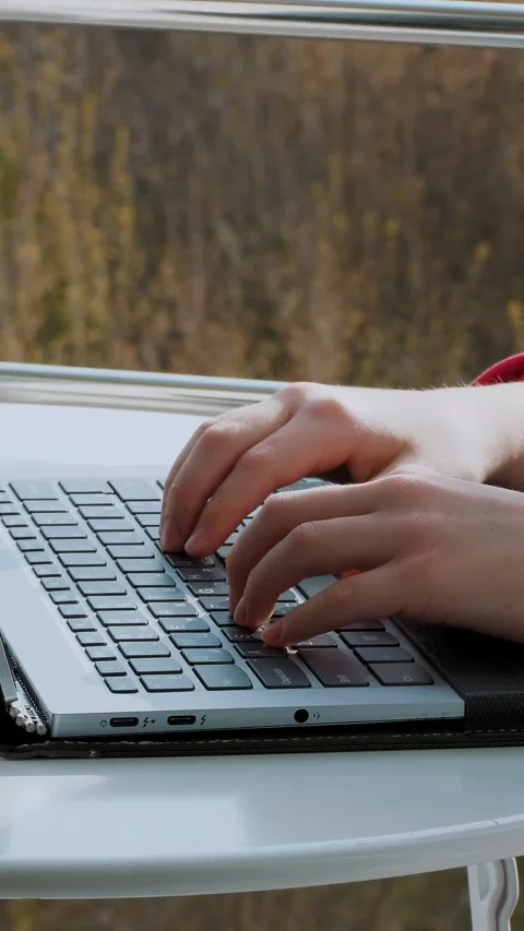 Close-up of hands typing on a laptop keyboard. teenager girl typing, working on Stock Footage 318808529