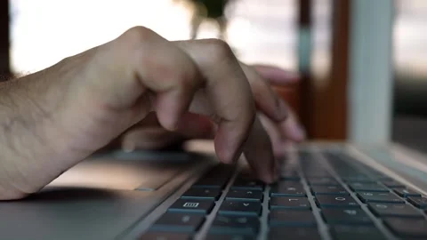 Close-up of hands typing on a laptop keyboard Stock Footage 320724243