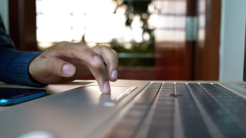 Close-up of hands typing on a laptop keyboard Stock Footage 320724259