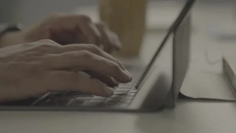 Close up of hands typing on a laptop keyboard Stockbeeldmateriaal 327596070