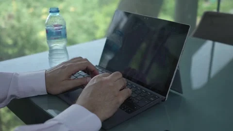 Close-up of hands typing on a laptop keyboard 库存影片 335959081