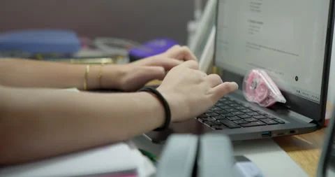 Close-up of hands typing on a laptop keyboard. Stock Footage 336399841