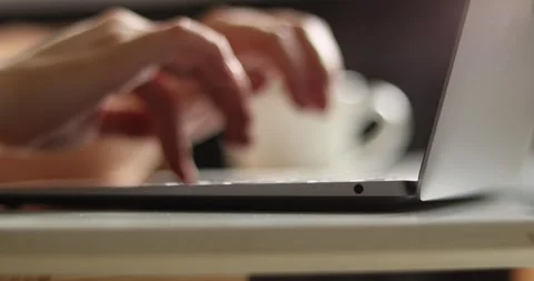 Close-up of hands typing on a laptop keyboard, focused on the action Stock Footage 339075766