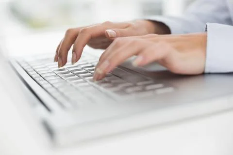 Close up of hands typing on laptop keyboard Stock Photos