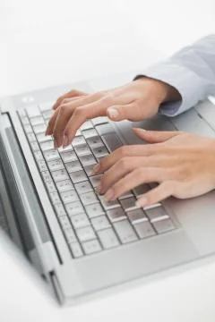 Close up of hands typing on laptop keyboard Stock Photos