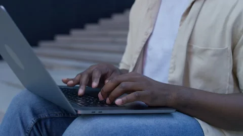 Close up of hands typing on laptop outdoors Stock Footage 315648989