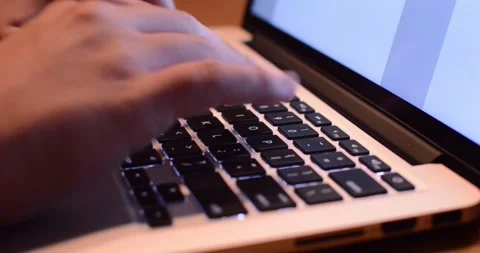 Close-up of hands typing on a MacBook Pro keyboard Video stock 317436589