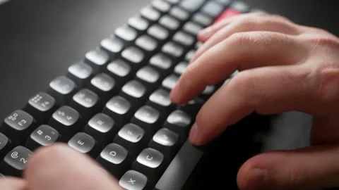 Close-up hands typing PC computer keyboard. Man using wireless mechanical k.. Stock Footage 302635925