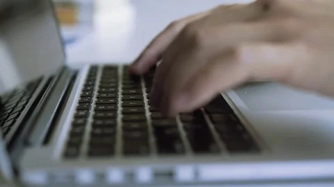 Close up of hands typing quickly on laptop keyboard. Camera movement Stock Footage 80527678
