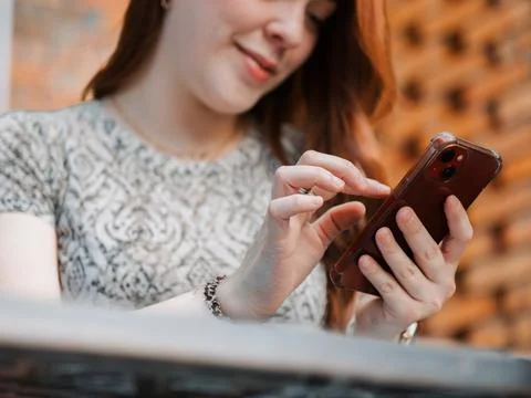 Close-up hands typing on smartphone Stock Photos