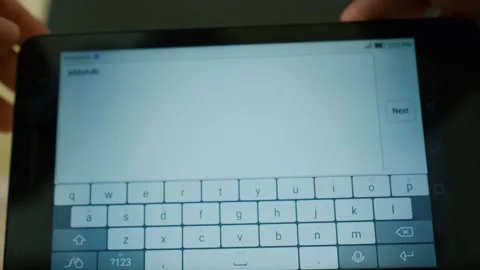 Close-up of hands typing on a smartphone touchscreen keyboard Stock Footage 317737124