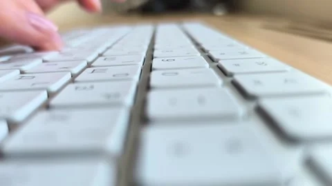 Close-up of hands typing text on a keyboard. Fingers pressing keys during f.. Stock Footage 340283657