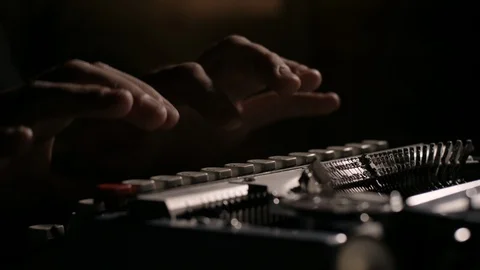 Close up of hands typing on a vintage typewriter in slow motion Stock Footage 97762293