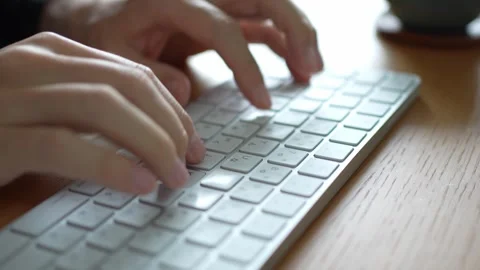 Close Up of Hands Typing on a White Desktop Keyboard Stock-Footage 330174792